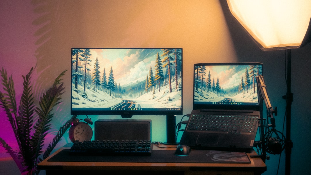 A modern desk setup with two screens.