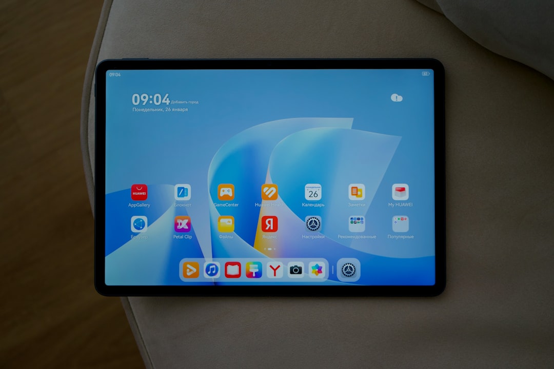 A tablet displaying apps and the time